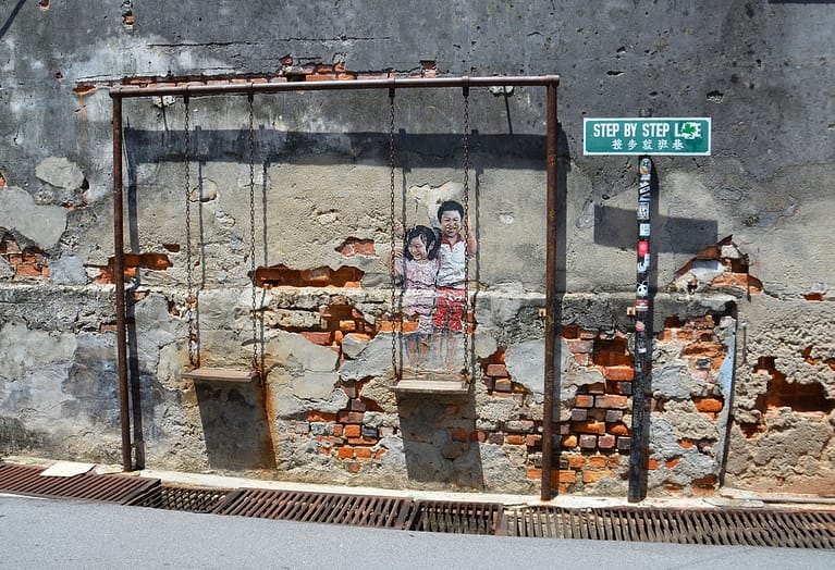 Explore the Iconic Street Art of Penang: Children on a swing