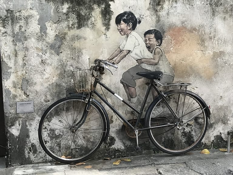 Explore the Iconic Street Art of Penang: Little Children on a Bicycle