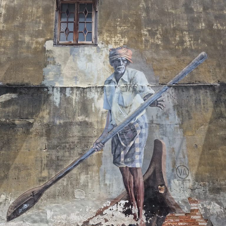 Explore the Iconic Street Art of Penang: The boat man